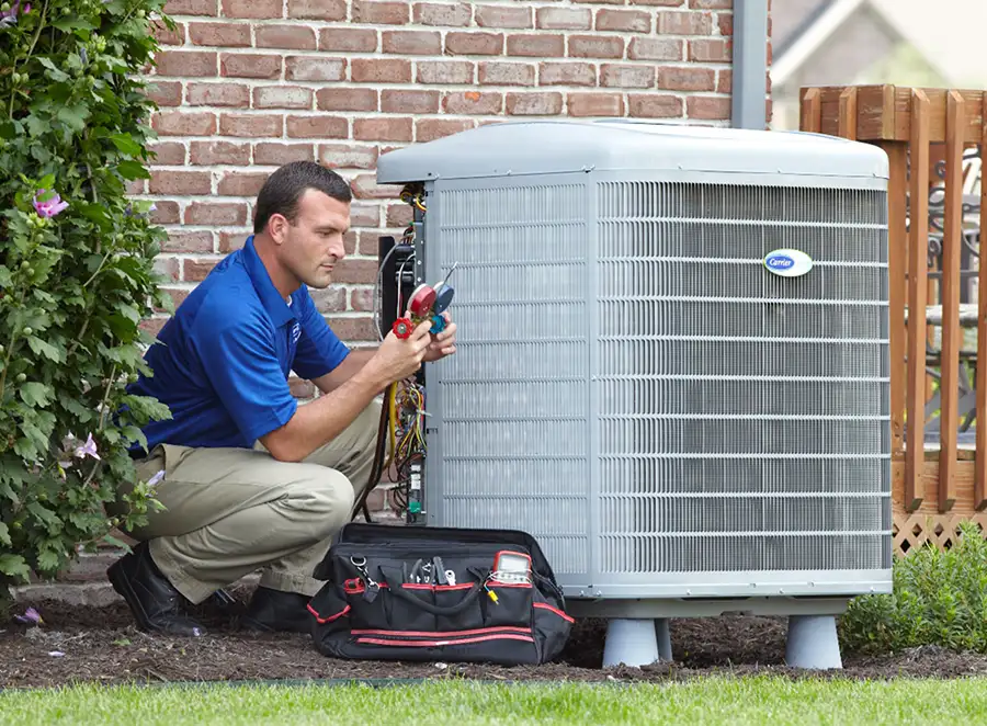 HVAC technician inspecting an outdoor AC unit in Hacienda Heights