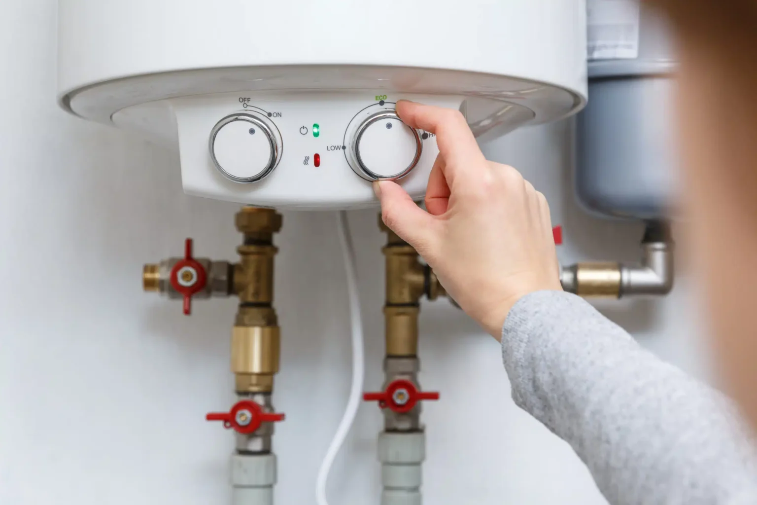 Technician adjusting a water heater in Hacienda Heights